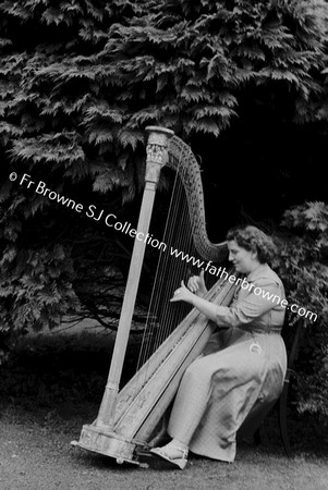 EILEEN MC CABE PLAYING HARP